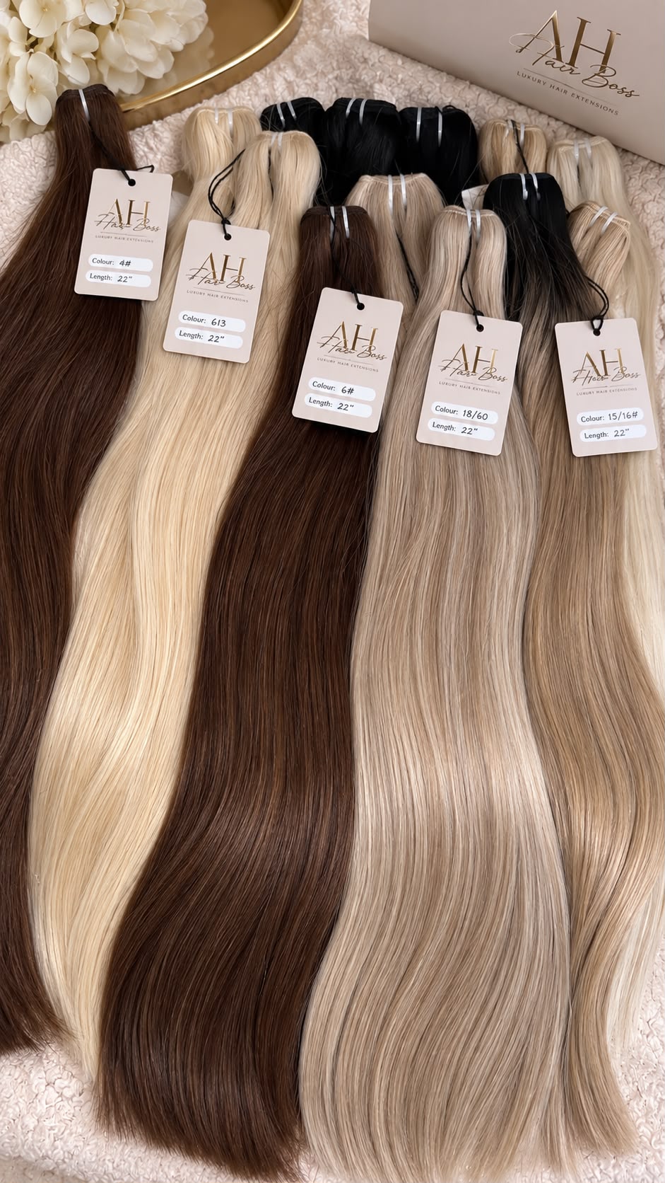 AH Hair Boss wefts laid out with shade tags including 4, 613, 6, 18/60 and 15/16