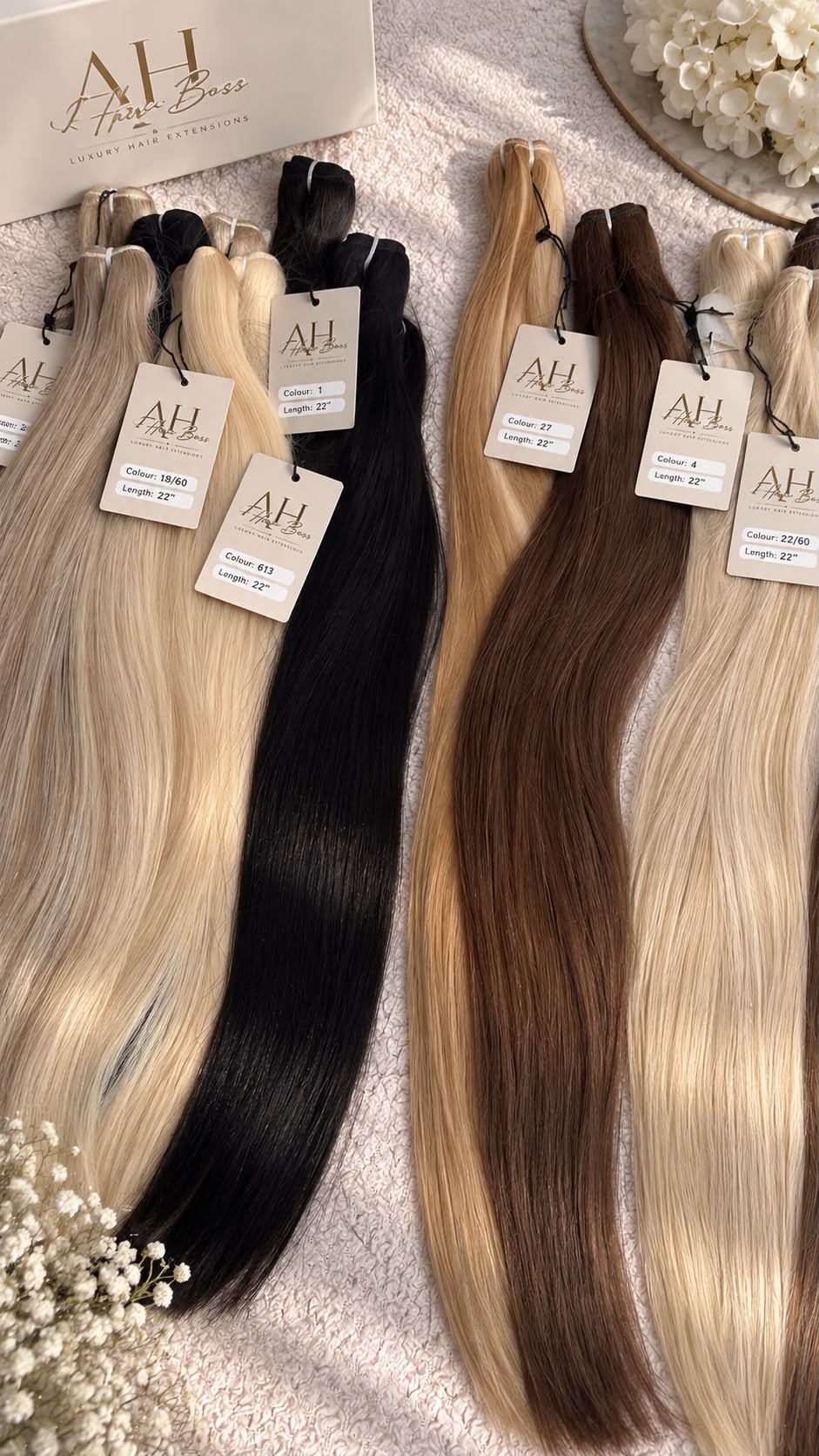 AH Hair Boss wefts in blonde, black and brown shades with branded shade tags